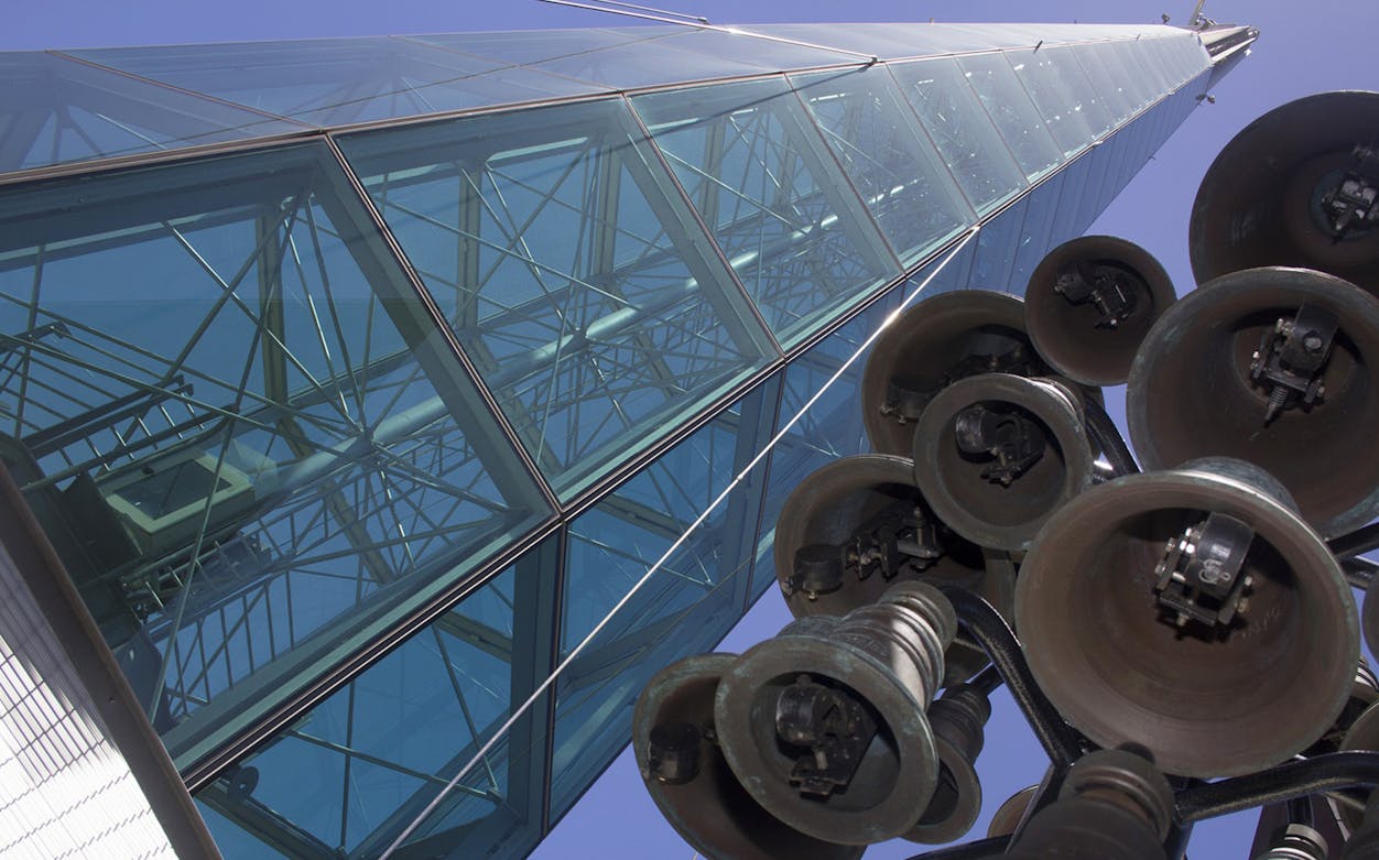 Glass tower with visible bells, part of The Bell Tower Experience.