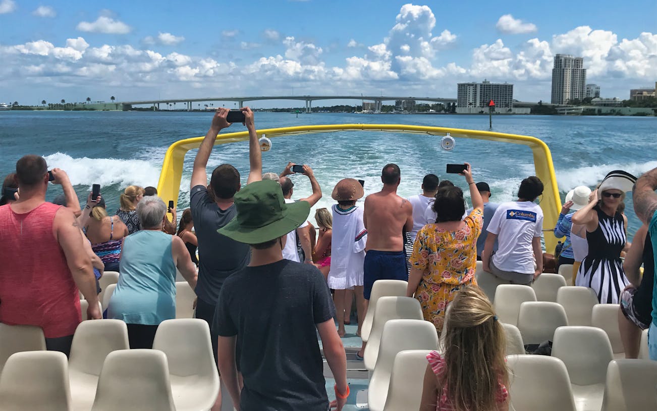 Tourists on a boat enjoying deep sea fishing in the Gulf of Mexico.