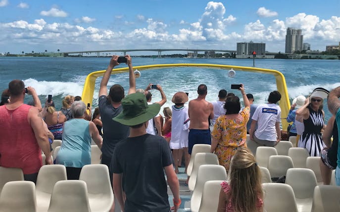 Tourists on a boat enjoying deep sea fishing in the Gulf of Mexico.