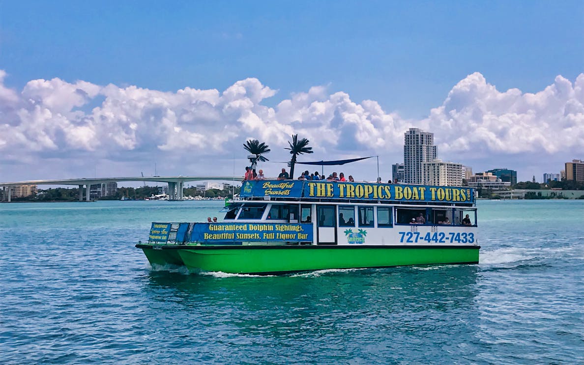 Tour boat on Clearwater Beach offering dolphin sightings and sunset views.