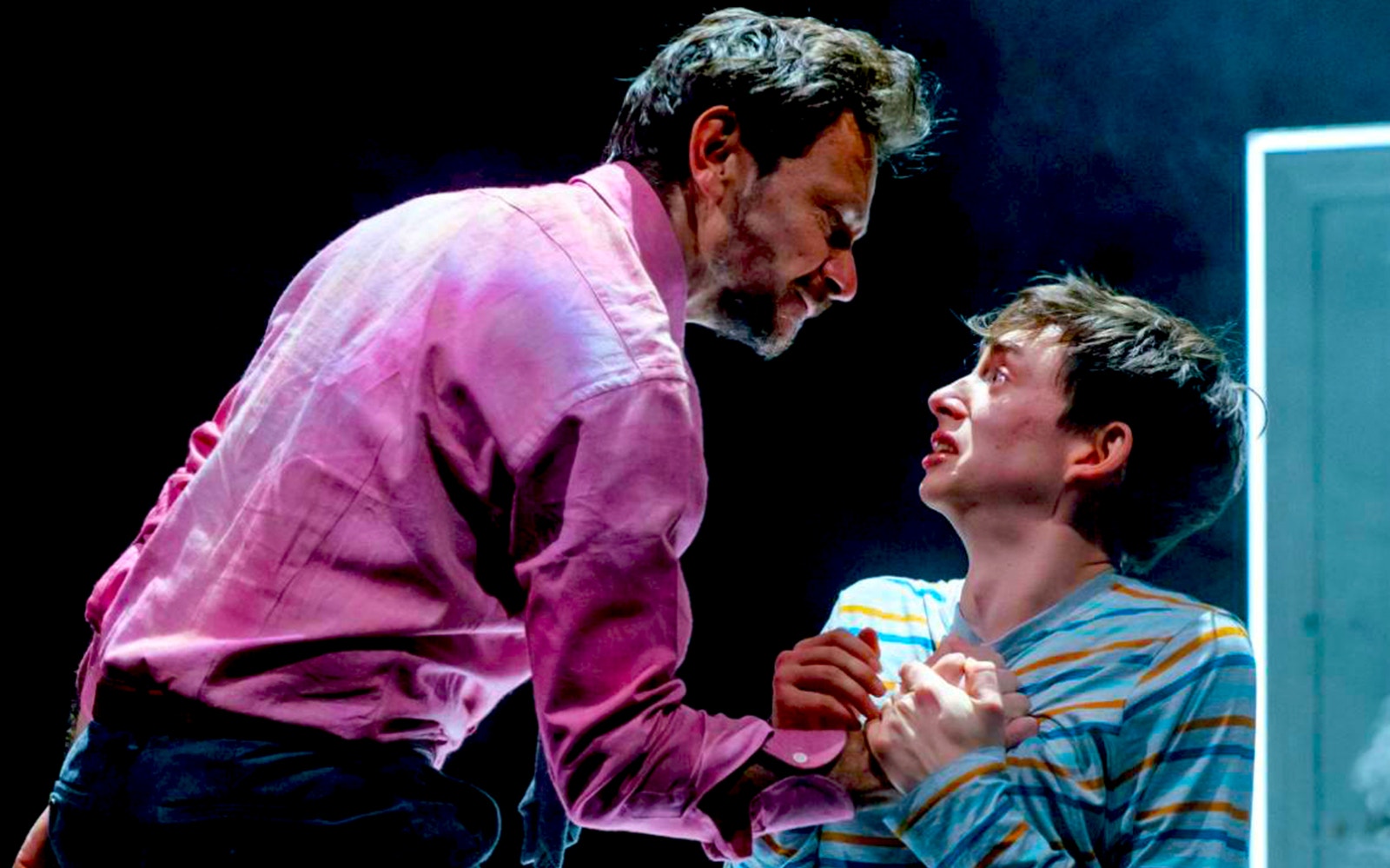 Two actors in an intense scene from "The Ocean at the End of the Lane" play.