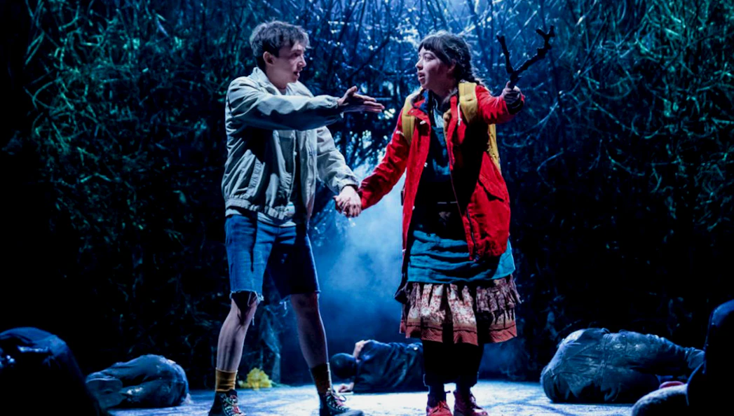 Two actors on stage in a dramatic scene from "The Ocean at the End of the Lane" play.