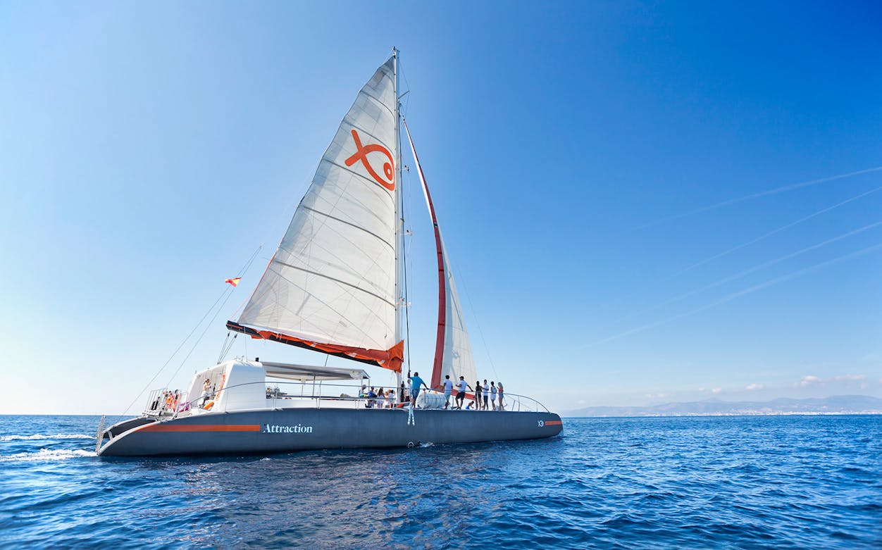 Catamaran sailing in Mallorca for snorkelling activity.