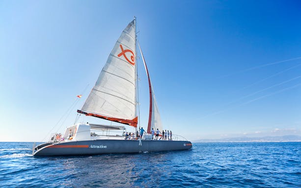 Sailing catamaran on Coll Baix Beach Boat Tour near Cap Formentor, Mallorca.