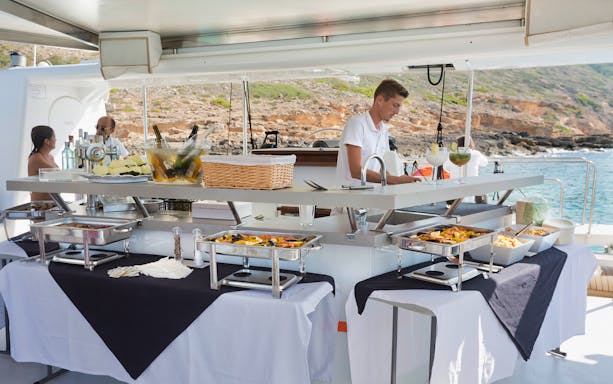 Buffet setup on a boat during Coll Baix Beach and Cap Formentor snorkelling tour.
