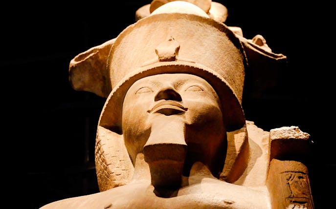Ancient Egyptian statue at the Egyptian Museum, Cairo, featured in skip-the-line guided tour.