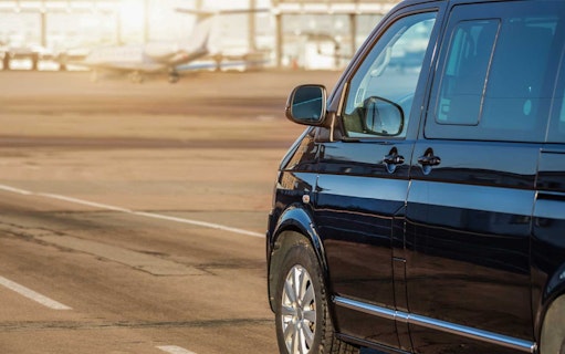 Black van at Sabiha Gokcen Airport for shared transfer in Istanbul.