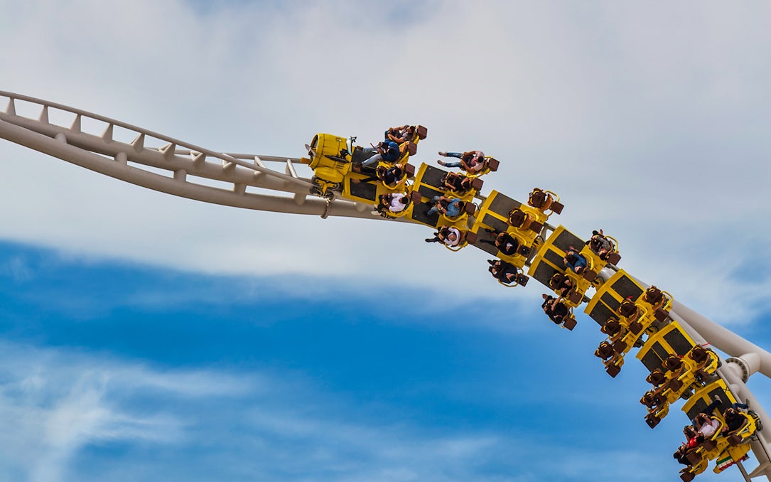 Roller coaster at Yas Island Abu Dhabi with riders on a loop.