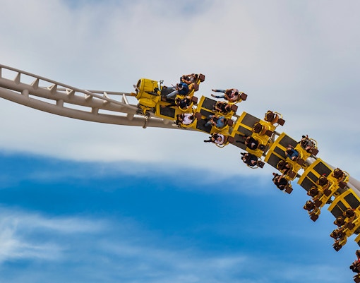 Roller coaster at Yas Island Abu Dhabi with riders on a loop.