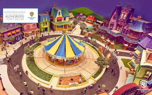 Warner Bros. World Abu Dhabi colorful village and carousel on Yas Island.