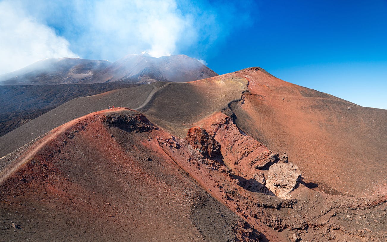 Mount Etna volcanic landscape with smoke, part of the Full-Day Tour of Etna Park, Acireale, & Acitrezza by Jeep.