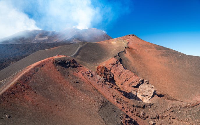 Mount Etna volcanic landscape with smoke, part of the Full-Day Tour of Etna Park, Acireale, & Acitrezza by Jeep.