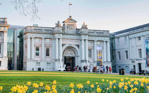 National Maritime Museum entrance with visitors, Greenwich, London.