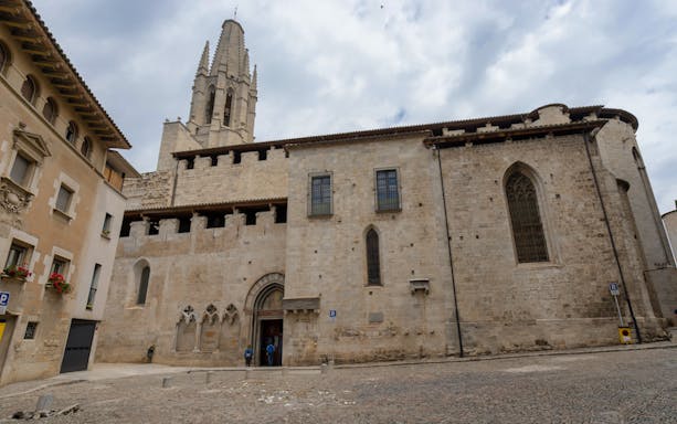 Cathedral of Girona exterior with bell tower and stone facade.