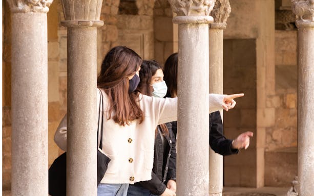 Visitors exploring the cloisters of Girona Cathedral.