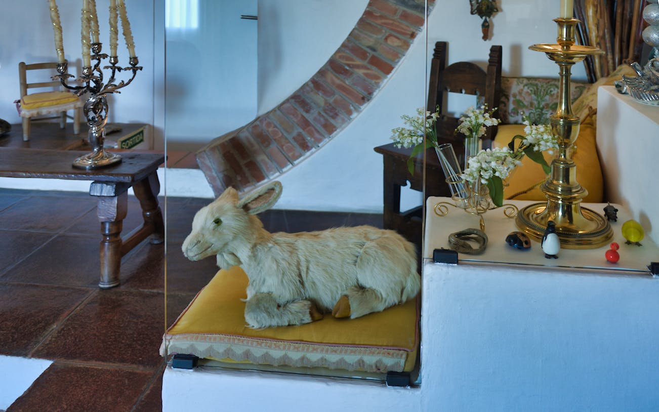 Stuffed rabbit on a cushion with decorative items in Dalí's house, Portlligat.