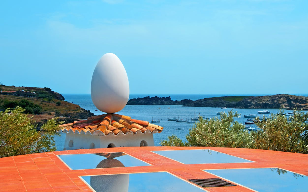 Rooftop egg sculpture at Dalí's house in Portlligat with sea view.