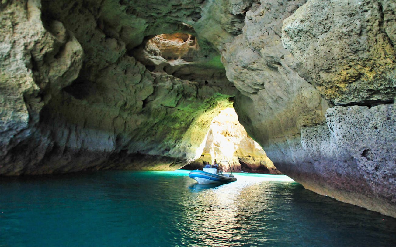 Boat entering Benagil Cave on tour from Portimao, Portugal.