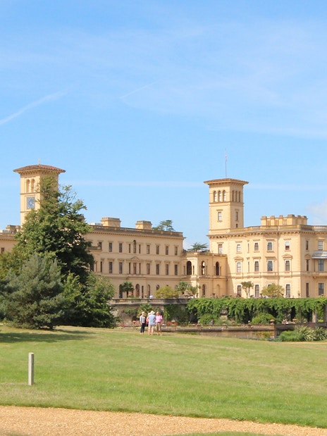 Osborne House with gardens and visitors on a sunny day, Isle of Wight.