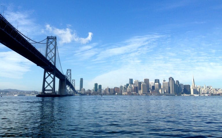 San Francisco skyline and Bay Bridge view from the water, part of Alcatraz city tour.