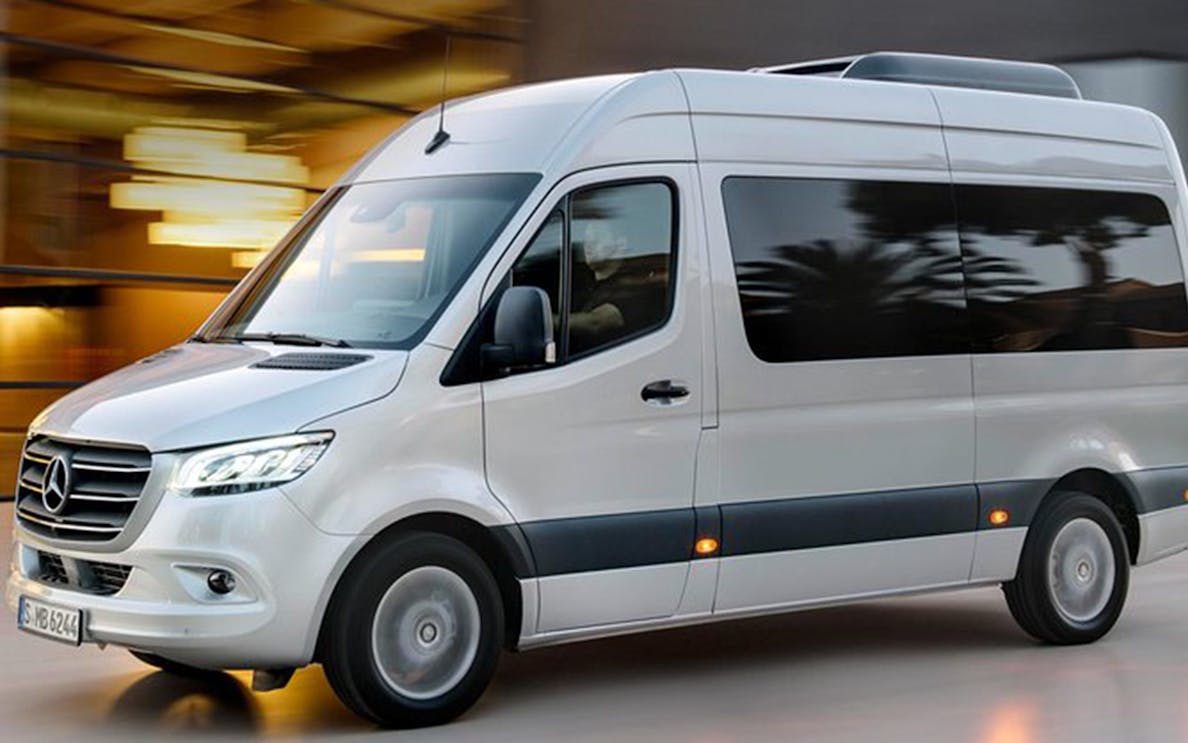 White van for Santorini airport transfers.