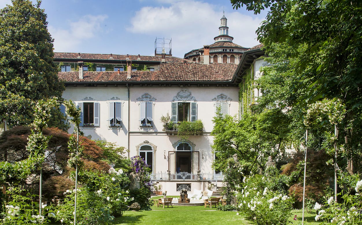 Leonardo's Vineyard garden with historic building in Milan, Italy.