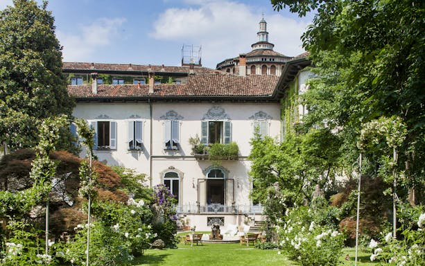 Leonardo's Vineyard garden with historic building in Milan, Italy.