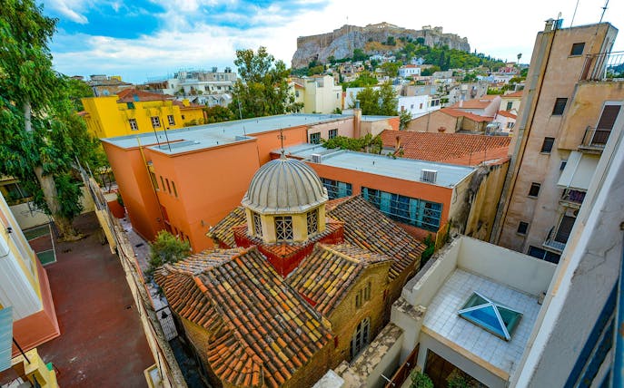 Rooftop view of Athens with the Acropolis in the background during a city walking tour.
