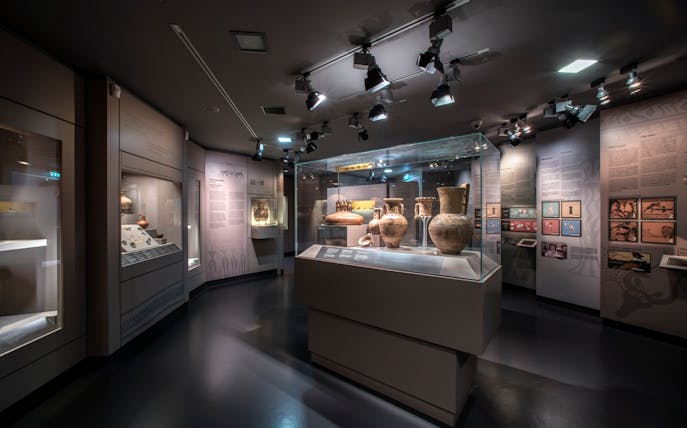 Ancient pottery display at Athens Museum of Cycladic Art.