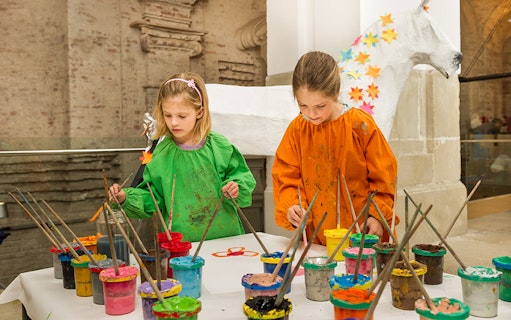 Children painting at Klosterneuburg Monastery art workshop, Austria.