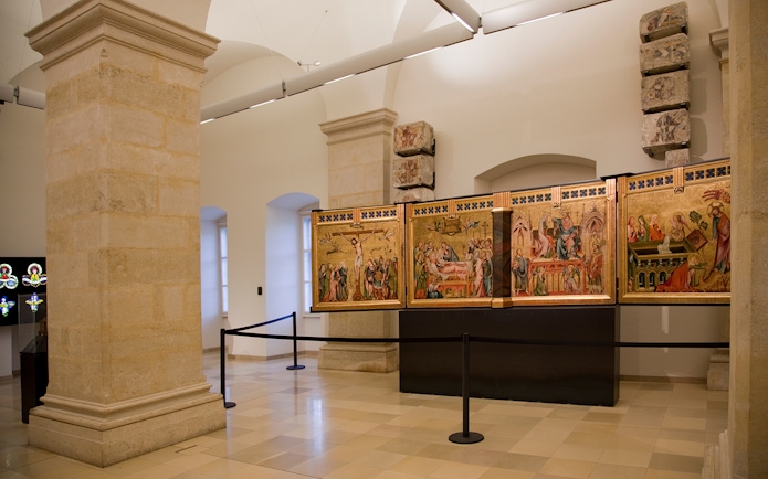 Klosterneuburg Monastery interior with historical religious paintings on display.