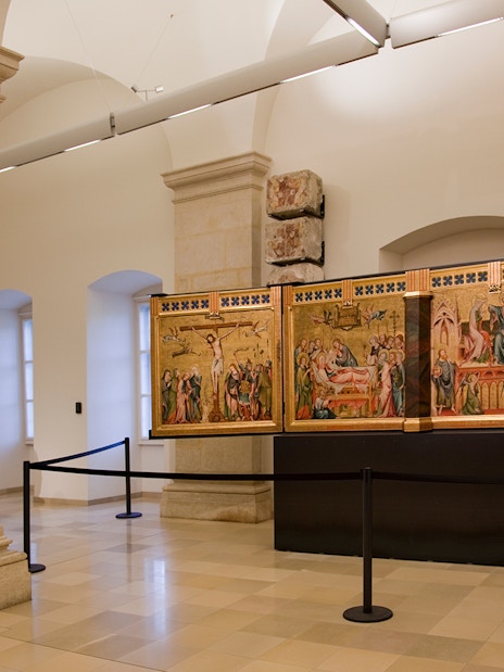 Klosterneuburg Monastery interior with historical religious paintings on display.