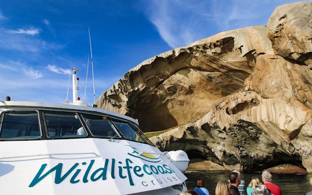 Cruise boat approaching rock formations at Wilsons Promontory, Australia.