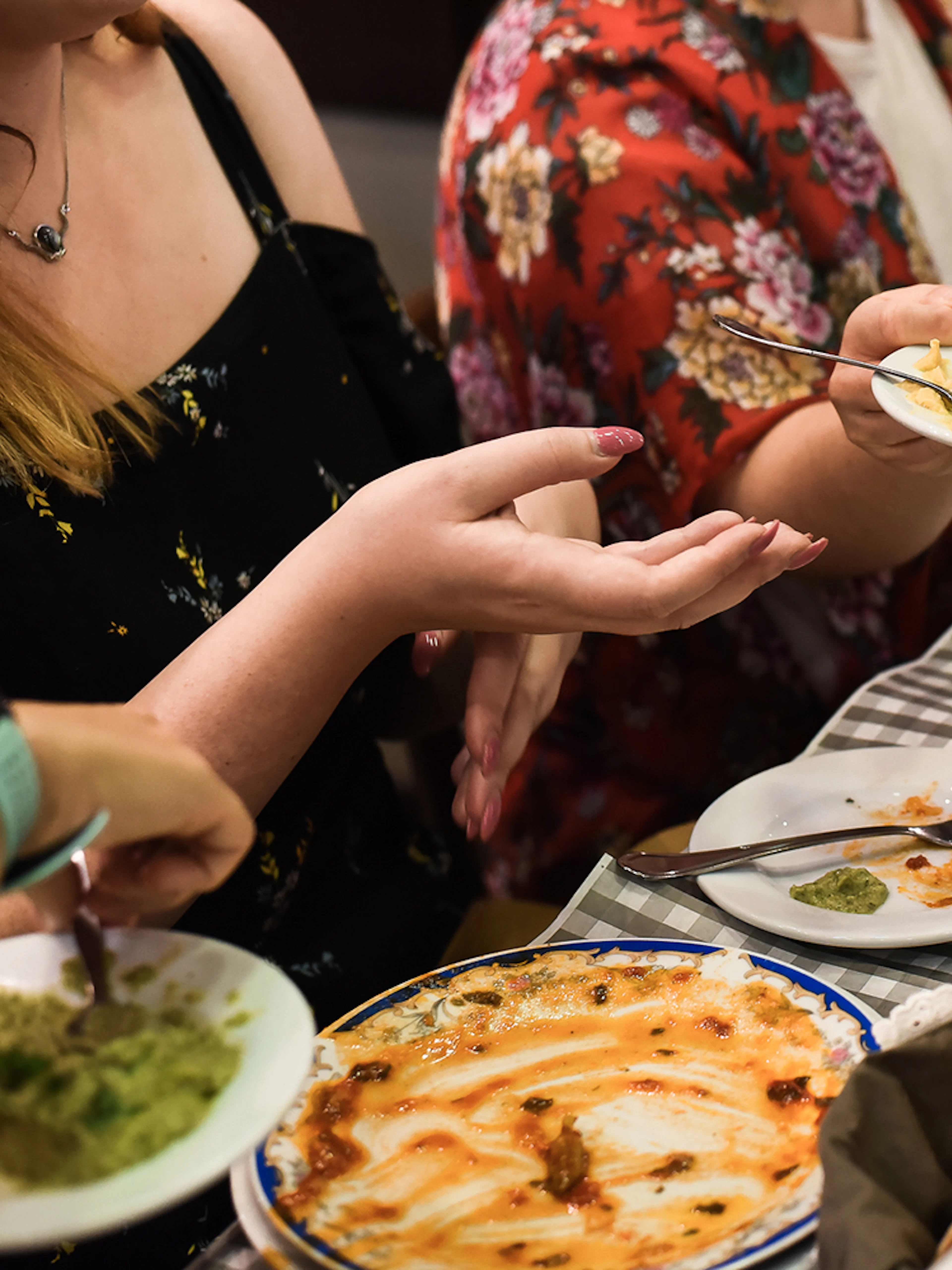 Group enjoying traditional Greek dishes at a table during Athens food tour.
