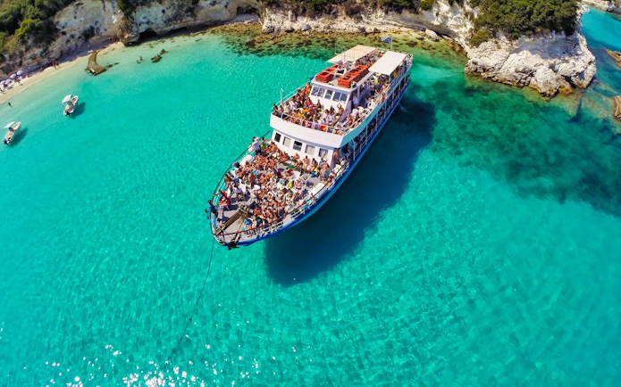 Cruise ship on clear blue waters near Paxos and Antipaxos islands.