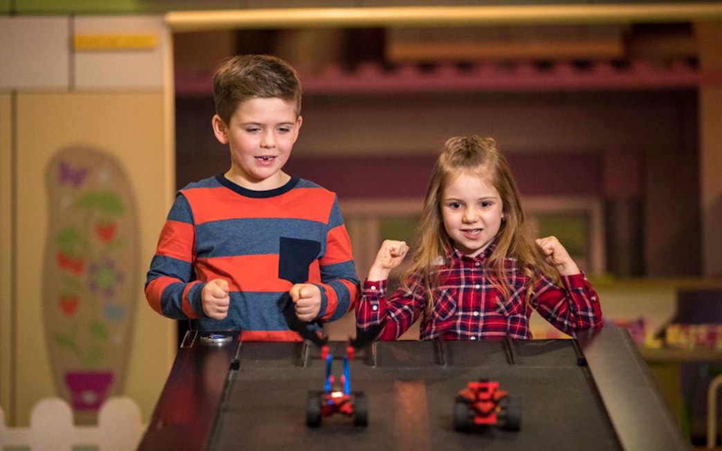 Children racing LEGO cars at LEGOLAND Discovery Centre Oberhausen.