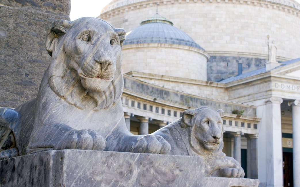 Stone lion statues at Piazza del Plebiscito, Naples, Italy.