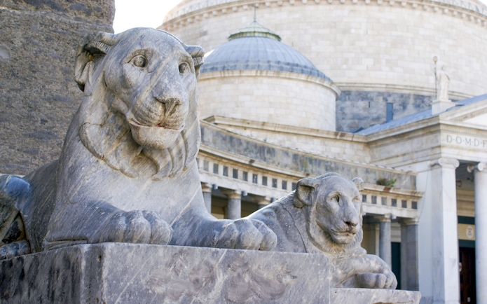 Stone lion statues at Piazza del Plebiscito, Naples, Italy.