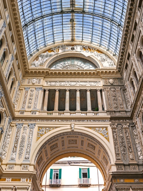 Diego Maradona mural in Naples, Italy, on a guided tour highlighting his legacy.