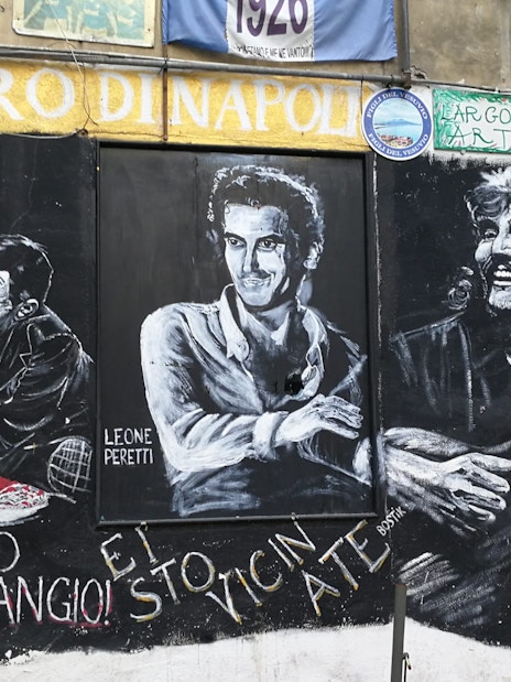 Street mural in Naples featuring Diego Maradona and local cultural icons.