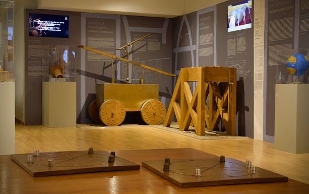 Ancient Greek technology exhibit featuring hydraulic and mechanical devices.