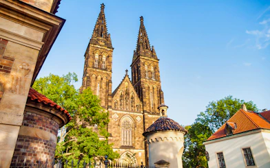 Vyšehrad Castle's twin spires and surrounding architecture in Prague.