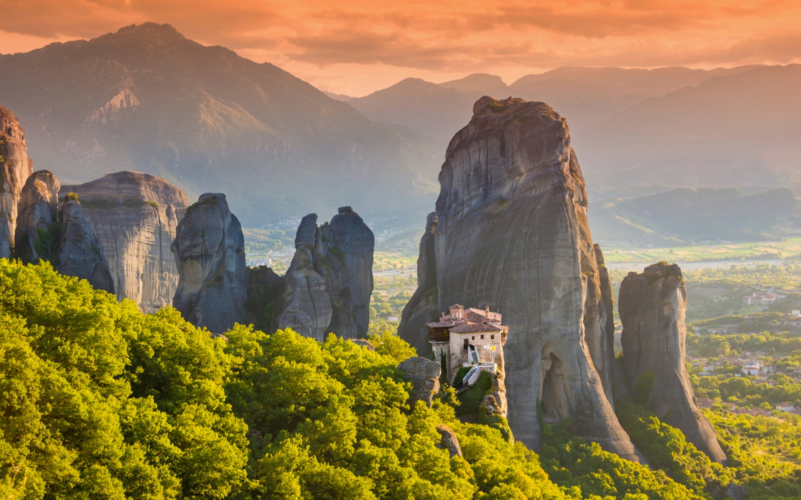 Meteora rock formations with monastery, Greece, viewed during Athens to Meteora full-day trip.