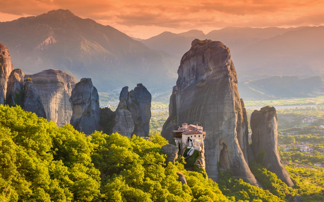 Meteora rock formations with monastery, Greece, viewed during Athens to Meteora full-day trip.