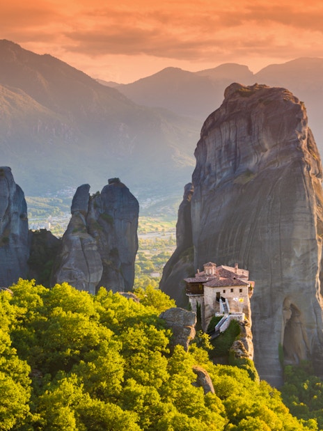 Meteora rock formations with monastery, Greece, viewed during Athens to Meteora full-day trip.