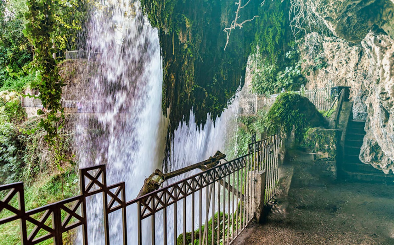 Waterfall view from behind a railing at Edessa, Greece, on the Pozar Thermal Baths day trip.
