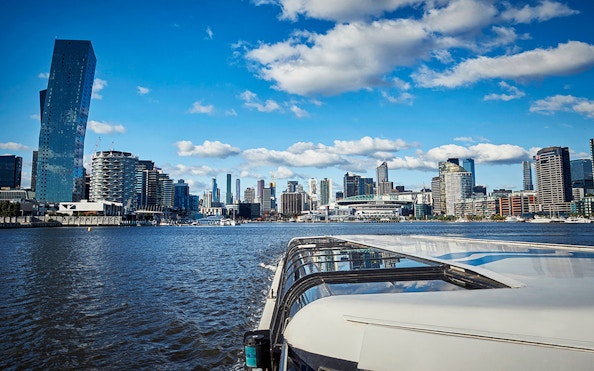 Ferry cruise on Yarra River with Melbourne skyline in the background.