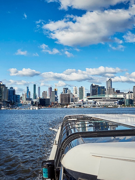 Ferry cruise on Yarra River with Melbourne skyline in the background.