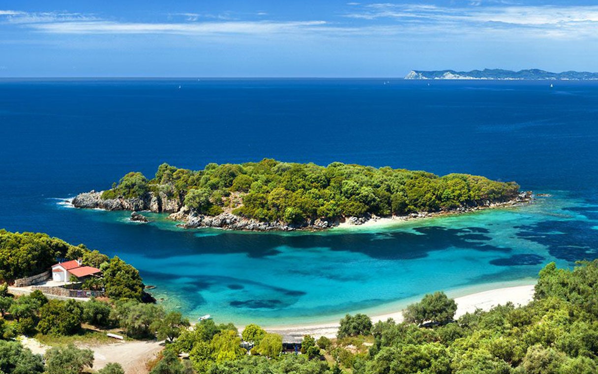 Blue Lagoon with lush greenery and clear waters on Sivota cruise from Corfu.
