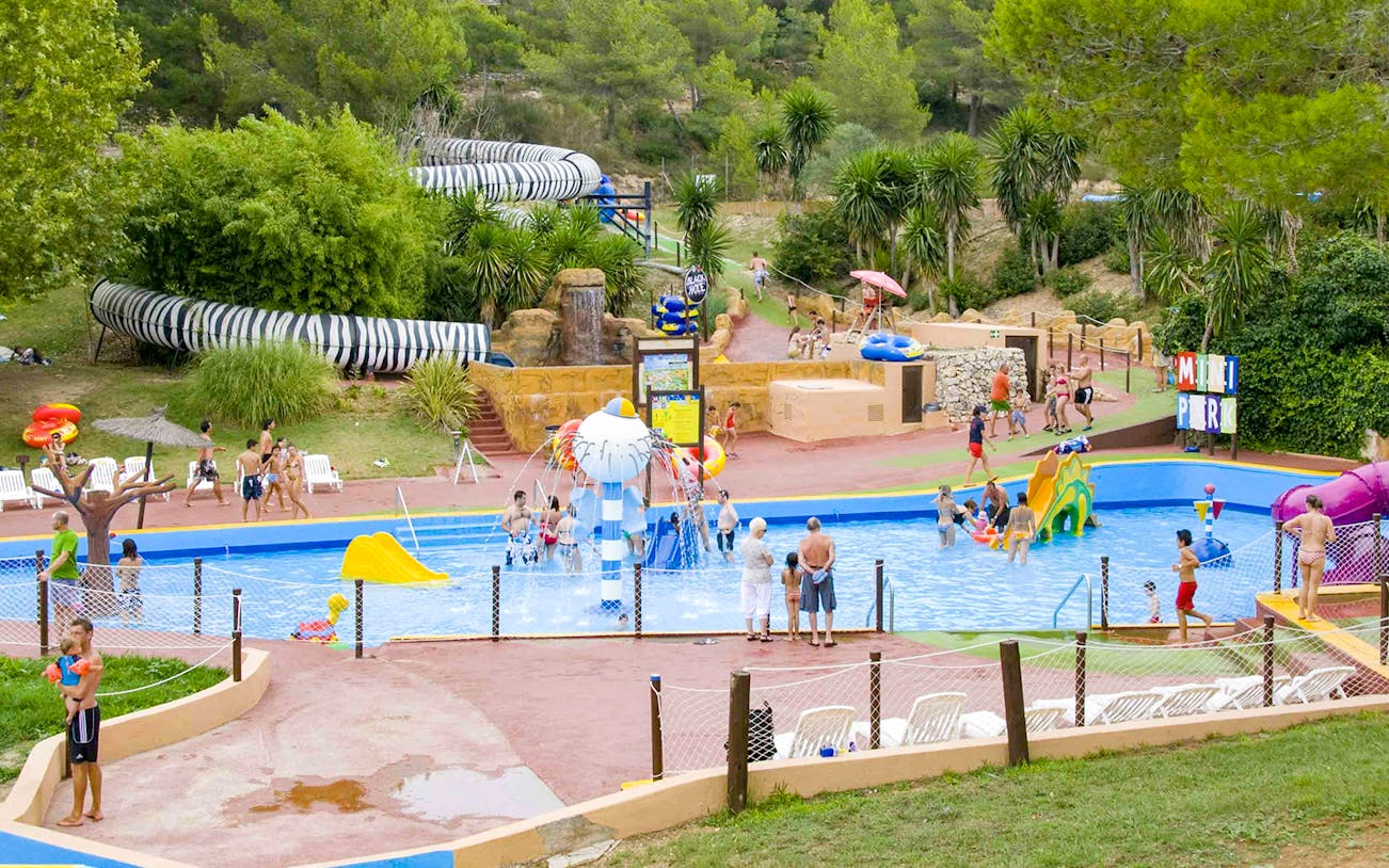 Visitors enjoying the pool and slides at Aqualeon Water Park.